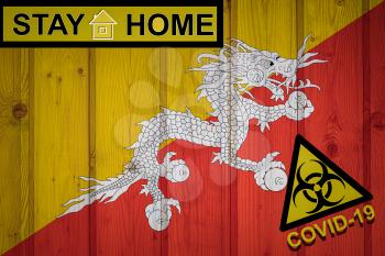 Flag of the Bhutan in original proportions. Quarantine and isolation - Stay at home. flag with biohazard symbol and inscription COVID-19.