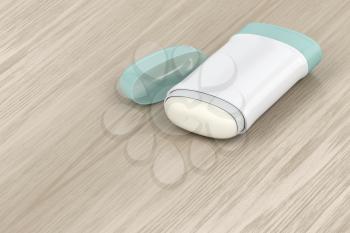 Antiperspirant deodorant stick on wood background