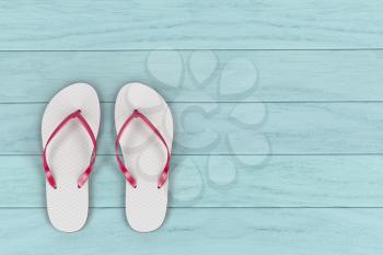 White flip flops on wooden floor, top view