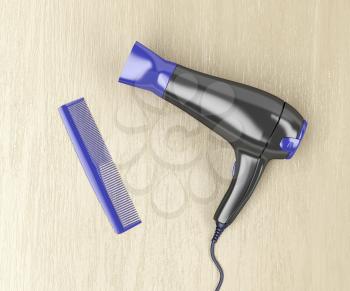 Black hair dryer and purple comb on wood table, top view