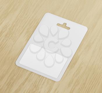 White blank gift card on wood background