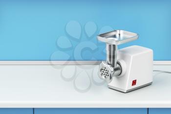 Electric meat grinder on kitchen table