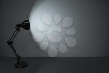 Black decorative lamps with empty desk background, 3d rendering. Computer digital drawing.