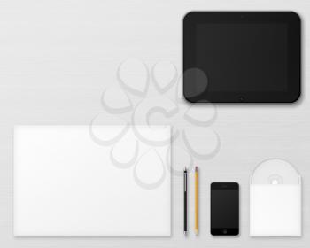 Office supplies for designers presentations and portfolios on wooden background. Above view.