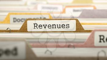 Revenues Concept on Folder Register in Multicolor Card Index. Closeup View. Selective Focus. 3D Render.