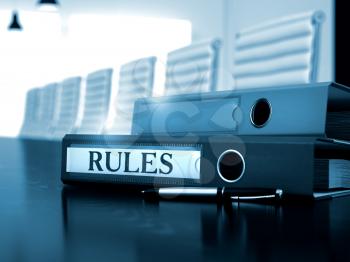 Rules - Folder on Black Wooden Desktop. Rules. Concept on Blurred Background. Rules - Illustration. Ring Binder with Inscription Rules on Office Desktop. 3D.