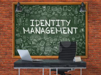 Green Chalkboard with the Text Identity Management Hangs on the Red Brick Wall in the Interior of a Modern Office. Illustration with Doodle Style Elements. 3D.
