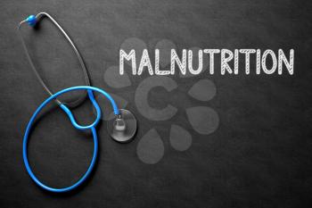 Medical Concept: Black Chalkboard with Malnutrition. Medical Concept: Malnutrition Handwritten on Black Chalkboard. Top View of Blue Stethoscope on Chalkboard. 3D Rendering.