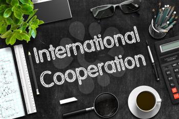 International Cooperation - Text on Black Chalkboard.3d Rendering. 