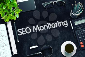 SEO Monitoring on Black Chalkboard. 3d Rendering. Toned Illustration.