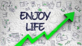 Enjoy Life Inscription on Modern Illustation. with Green Arrow and Hand Drawn Icons Around. Enjoy Life - Improvement Concept. Inscription on the Brick Wall with Hand Drawn Icons Around. 