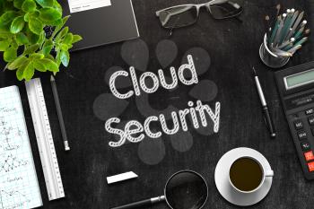 Cloud Security Handwritten on Black Chalkboard. Top View of Black Office Desk with a Lot of Business and Office Supplies on It. 3d Rendering. Toned Image.