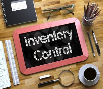 Inventory Control Handwritten on Red Small Chalkboard. Top View of Wooden Office Desk with a Lot of Business and Office Supplies on It. Small Chalkboard with Inventory Control. 3d Rendering.