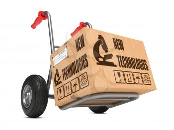 New Technologies Slogan on Cardboard Box on Hand Truck White Background.