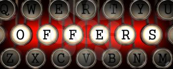 Offers on Old Typewriter's Keys on Red Background.