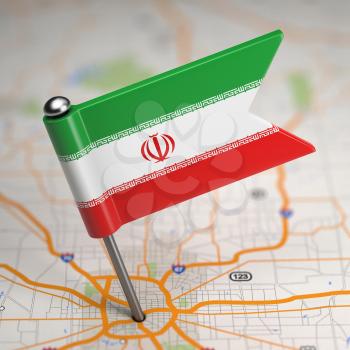 Small Flag of Islamic Republic of Iran on a Map Background with Selective Focus.