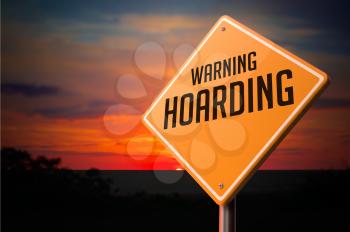 Hoarding on Warning Road Sign on Sunset Sky Background.