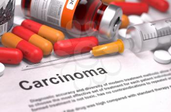 Carcinoma - Printed Diagnosis with Blurred Text. On Background of Medicaments Composition - Red Pills, Injections and Syringe.