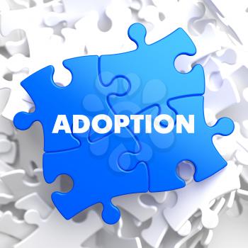 Adoption on Blue Puzzle on White Background.