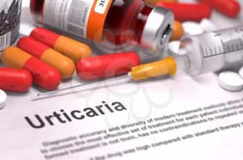 Diagnosis - Urticaria. Medical Report with Composition of Medicaments - Red Pills, Injections and Syringe. Selective Focus.