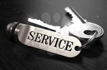 Service Concept. Keys with Keyring on Black Wooden Table. Closeup View, Selective Focus, 3D Render. Black and White Image.