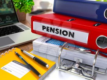 Red Ring Binder with Inscription Pension on Background of Working Table with Office Supplies, Laptop, Reports. Toned Illustration. Business Concept on Blurred Background.