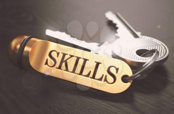 Keys with Word Skills on Golden Label over Black Wooden Background. Closeup View, Selective Focus, 3D Render. Toned Image.