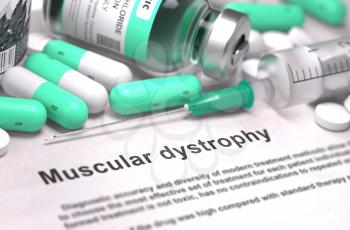 Muscular Dystrophy - Printed Diagnosis with Mint Green Pills, Injections and Syringe. Medical Concept with Selective Focus.