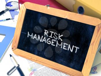 Hand Drawn Risk Management - Business Concept  on Chalkboard. Blurred Background. Toned Image.