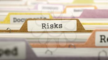 Risks Concept. Colored Document Folders Sorted for Catalog. Closeup View. Selective Focus.