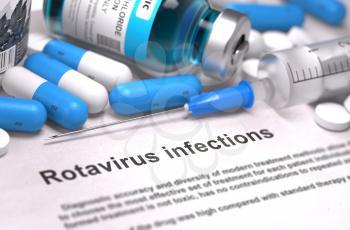 Rotavirus Infections - Printed Diagnosis with Blurred Text. On Background of Medicaments Composition - Blue Pills, Injections and Syringe.