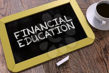 Financial Education Handwritten by White Chalk on a Blackboard. Composition with Small Yellow Chalkboard and Cup of Coffee. Top View.