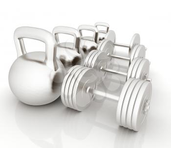 Metall weights and dumbbells on a white background