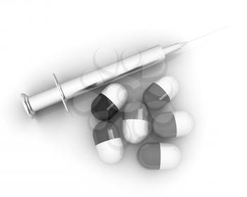 Pills and syringe on a white background
