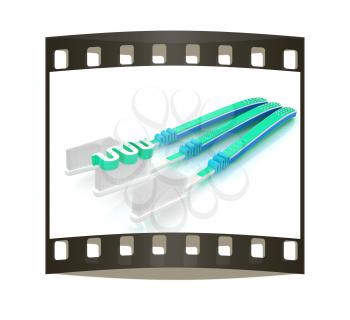 Toothbrushes on a white background. The film strip