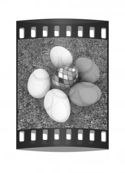 Eggs and easter eggs and grass. The film strip