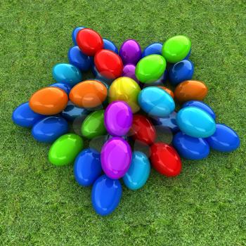 Colored Easter eggs as a flower on a green grass