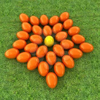 Colored Easter eggs as a flower on a green grass