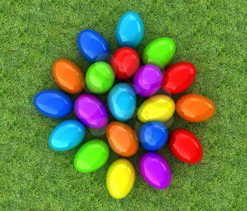 Colored Easter eggs on a green grass