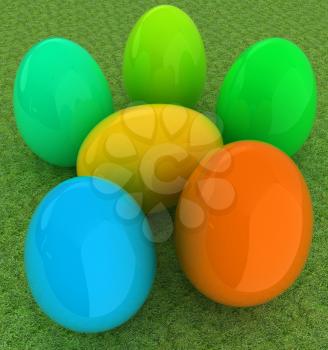 Colored Easter eggs on a green grass