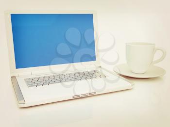 3d cup and a laptop on a white background