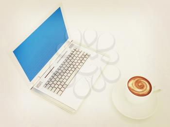 3d cup and a laptop on a white background