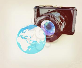 3d illustration of photographic camera and Earth on white background