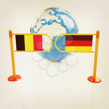 Three-dimensional image of the turnstile and flags of Germany and Belgium on a white background . 3D illustration. Vintage style.