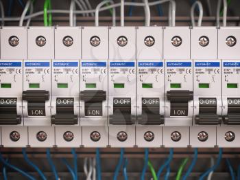 Electric switches in fusebox. Many black circuit brakers in a row. 3d illustration