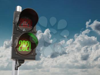 Traffic light with green light 2021 and red 2020 on sky background. Start New 2021 Year concept. 3d illustration