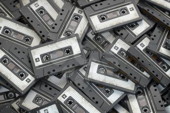 Heap of vintage audio cassettes. Retro music concept background. 3d illustration