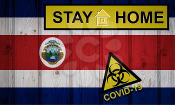 Flag of the Costa Rica in original proportions. Quarantine and isolation - Stay at home. flag with biohazard symbol and inscription COVID-19.