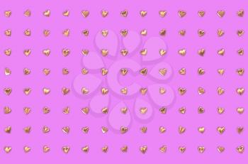 Valentine's Day abstract 3D illustration or pattern with shiny gold or golden metallic hearts in columns and rows on pink or rosy background.