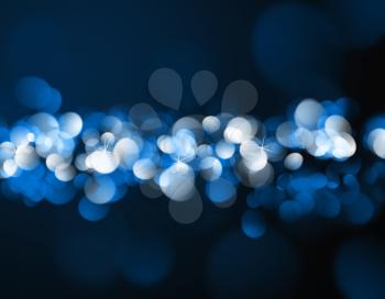 Christmas background with blue and white bokeh lights